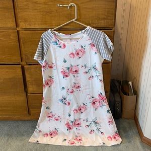 Floral T-shirt dress with striped cotton sleeves.